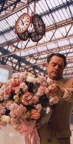 Delboy Holding Flowers